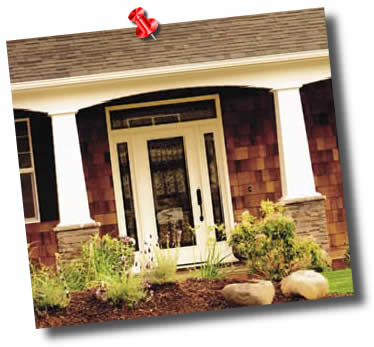 Square Tapered Columns on a front porch are installed on stone pedestals.